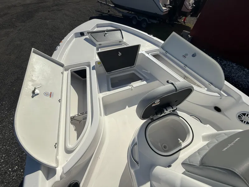 Slide: The Image of 2025 NauticStar 214 Shallow Bay boat interior with open storage compartments. - 9