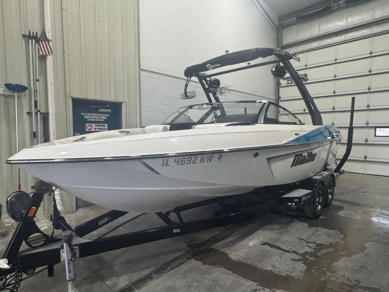 Slide: The Image of 2017 Malibu Wakesetter 23 LSV boat on trailer in indoor storage. - 1