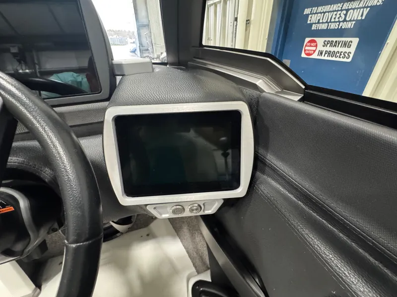 Slide: The Image of Dashboard of a 2017 Malibu Wakesetter 23 LSV boat with touchscreen display. - 10