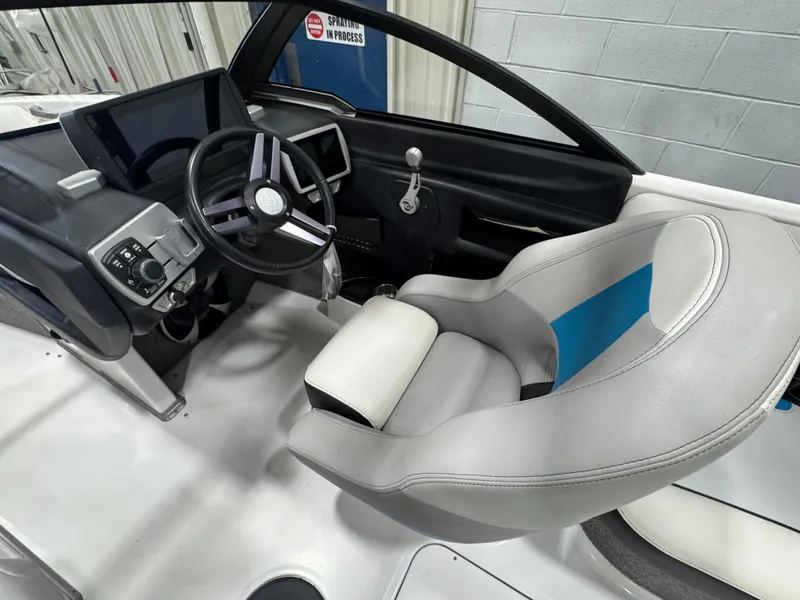 Slide: The Image of Interior of 2017 Malibu Wakesetter 23 LSV boat with steering wheel and captain's seat. - 8