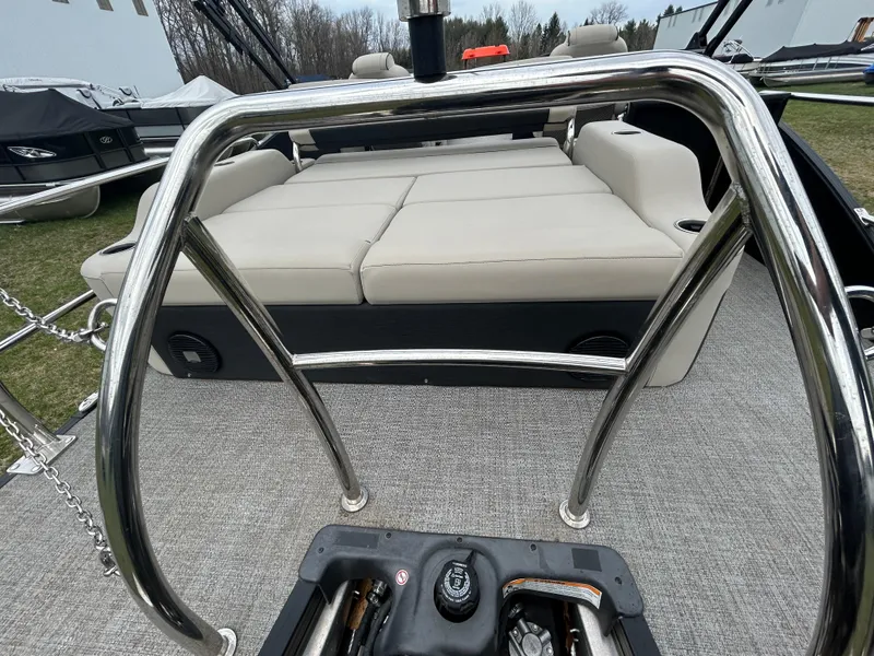 Slide: The Image of 2021 Barletta C24UC Triple Toon pontoon boat with spacious seating and sleek design. - 24