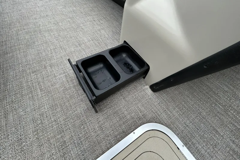 Slide: The Image of Cup holder on 2021 Barletta C24UC Triple Toon boat, featuring a sleek interior design. - 30