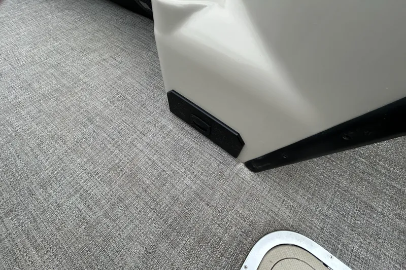 Slide: The Image of 2021 Barletta C24UC Triple Toon interior with textured flooring and sleek panel design. - 31