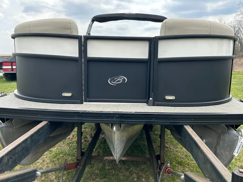 Slide: The Image of 2021 Barletta C24UC Triple Toon pontoon boat on trailer, rear view. - 7