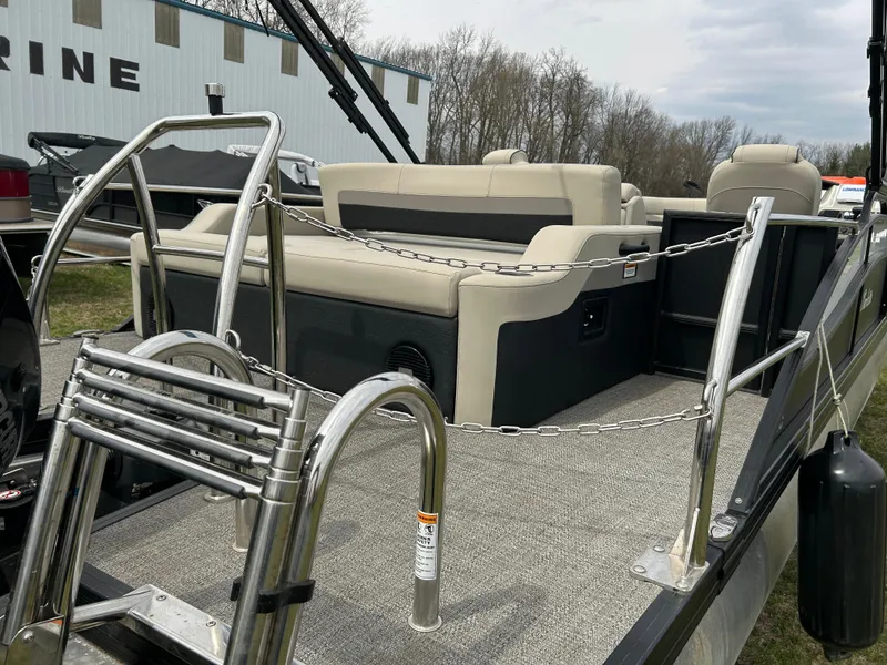 Slide: The Image of 2021 Barletta C24UC Triple Toon pontoon boat with seating and stainless steel railings. - 9