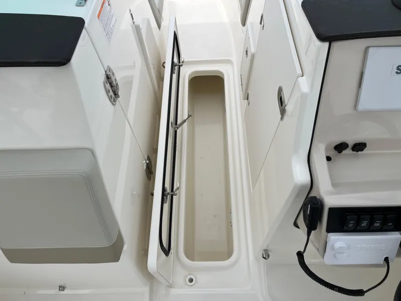 Slide: The Image of 2025 Boston Whaler 240 Vantage boat storage compartment with open hatch. - 18