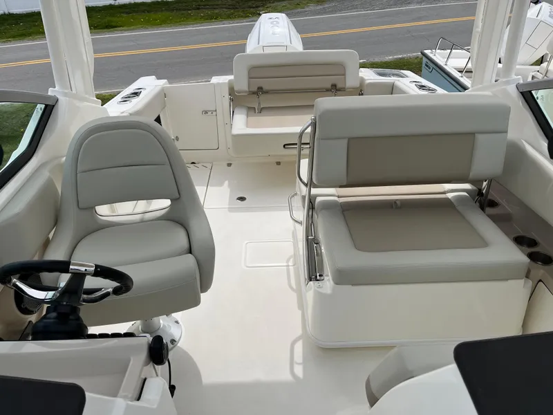 Slide: The Image of 2025 Boston Whaler 240 Vantage interior with seating and steering wheel, showcasing modern design. - 21