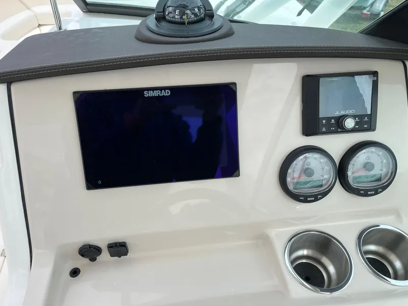 Slide: The Image of Dashboard of 2025 Boston Whaler 240 Vantage with navigation and control instruments. - 25