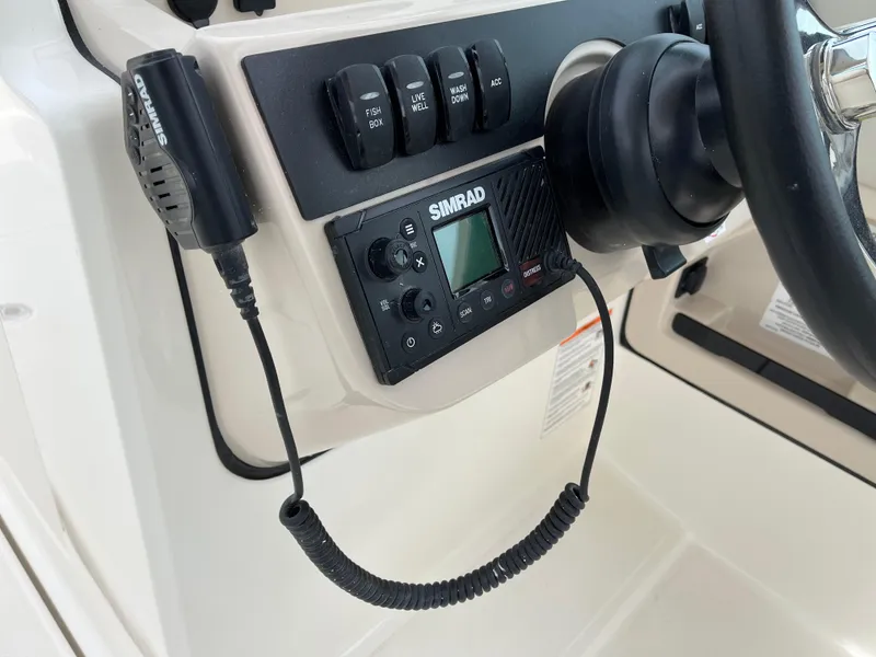 Slide: The Image of Control panel of 2025 Boston Whaler 240 Vantage with Simrad marine electronics. - 26