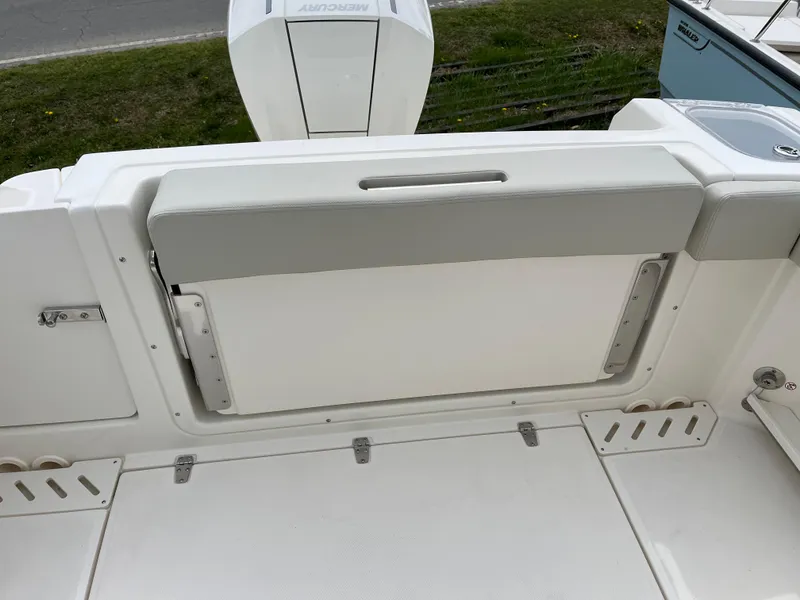 Slide: The Image of 2025 Boston Whaler 240 Vantage boat interior, featuring a foldable seat and clean design. - 27