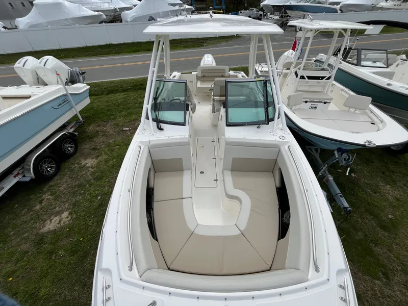 Slide: The Image of 2025 Boston Whaler 240 Vantage boat with spacious seating and sleek design. - 3