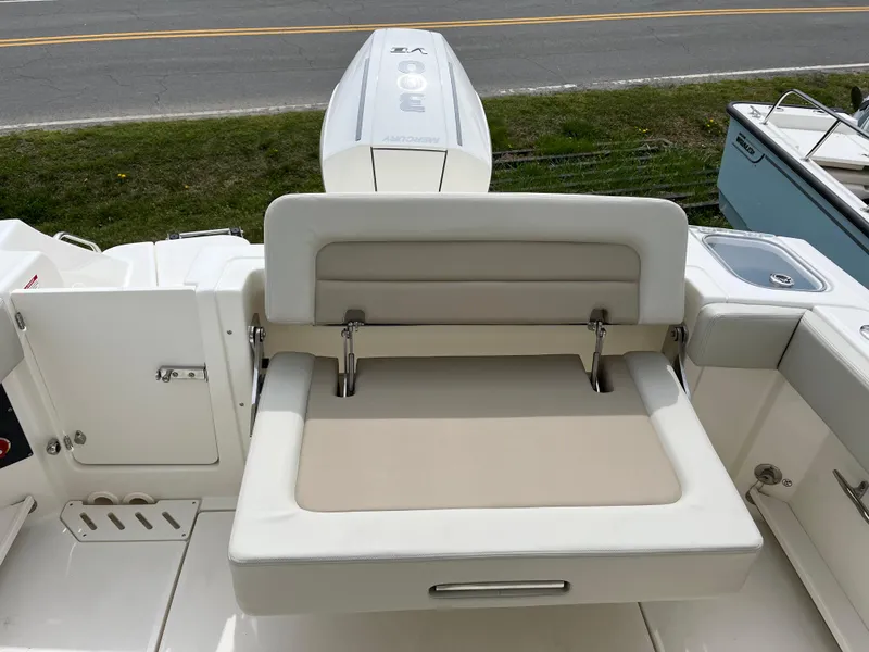 Slide: The Image of 2025 Boston Whaler 240 Vantage boat with foldable seating and sleek design. - 8