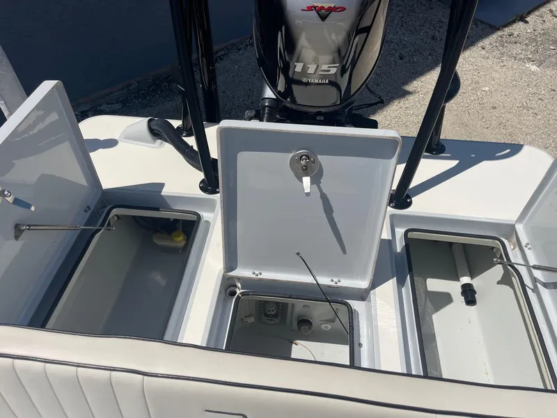 Slide: The Image of 2019 Maverick Mirage 18 HPX-V boat storage compartments and Yamaha engine. - 13