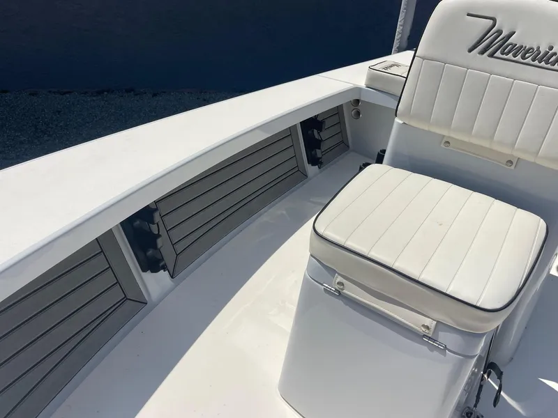 Slide: The Image of 2019 Maverick Mirage 18 HPX-V boat interior with white seating and storage compartments. - 16
