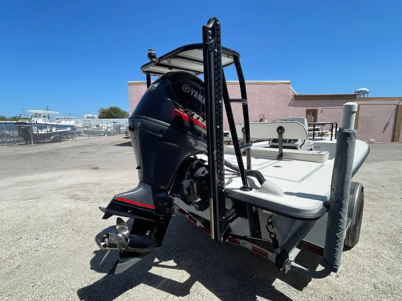 Slide: The Image of 2019 Maverick Mirage 18 HPX-V boat with Yamaha outboard motor, parked outdoors. - 3