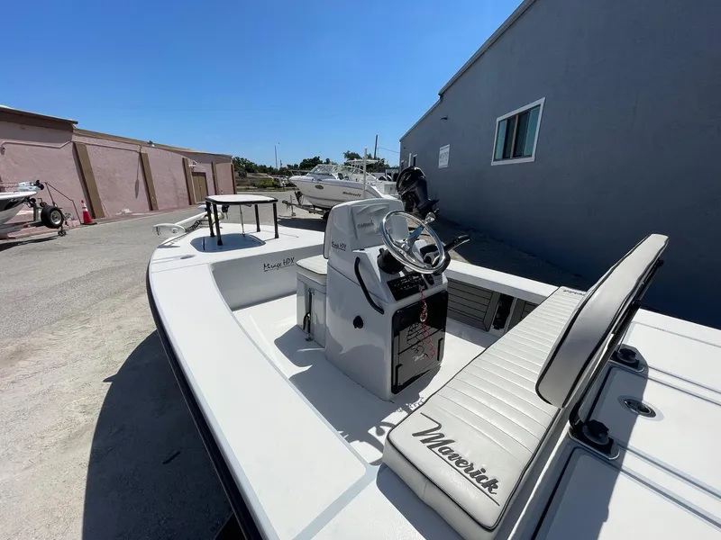 Slide: The Image of 2019 Maverick Mirage 18 HPX-V boat with sleek design, parked outdoors. - 4