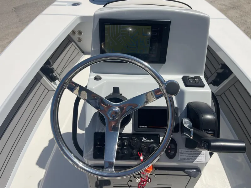 Slide: The Image of 2019 Maverick Mirage 18 HPX-V boat console with steering wheel and navigation display. - 9