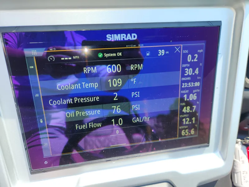 Slide: The Image of Simrad display showing engine metrics on a 2023 Premier 250 Intrigue RL boat. - 17