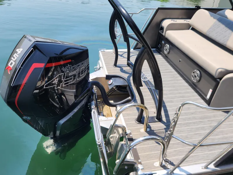 Slide: The Image of 2023 Premier 250 Intrigue RL boat with powerful outboard motor and spacious seating. - 3