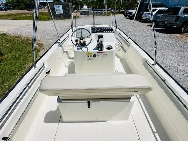 Slide: The Image of 2018 Boston Whaler 170 Montauk boat interior with steering console and seating. - 12