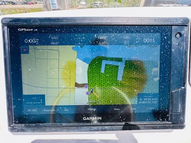 Slide: The Image of Garmin GPS display on 2018 Boston Whaler 170 Montauk boat, showing navigation map. - 16