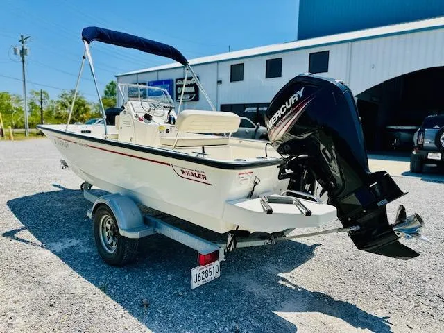 Slide: The Image of 2018 Boston Whaler 170 Montauk boat on trailer with Mercury outboard motor. - 4