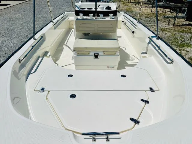 Slide: The Image of 2018 Boston Whaler 170 Montauk boat interior with seating and storage compartments. - 8