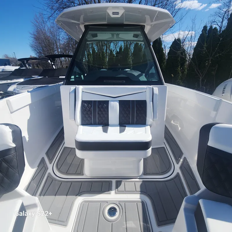 Slide: The Image of 2025 Monterey Elite 27 OB boat interior with sleek seating and modern design. - 10