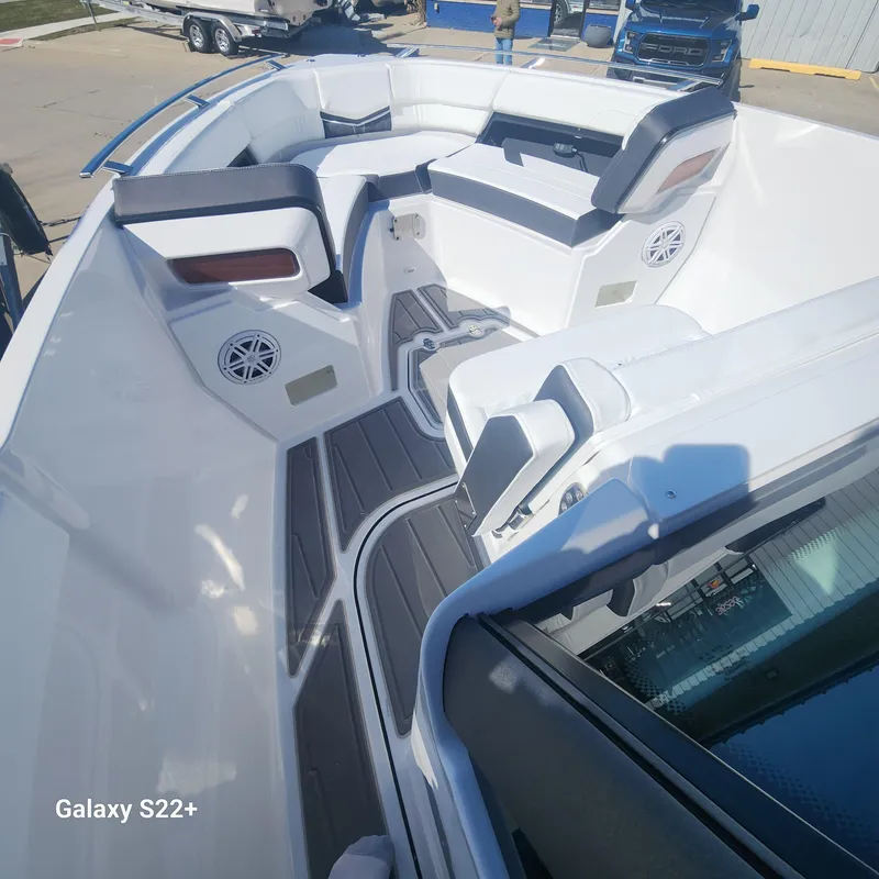 Slide: The Image of 2025 Monterey Elite 27 OB boat interior with sleek seating and modern design. - 9