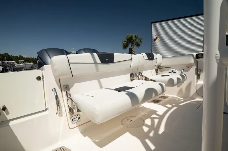 Slide: The Image of 2018 Wellcraft 302 Fisherman boat interior with white seating and modern design. - 14