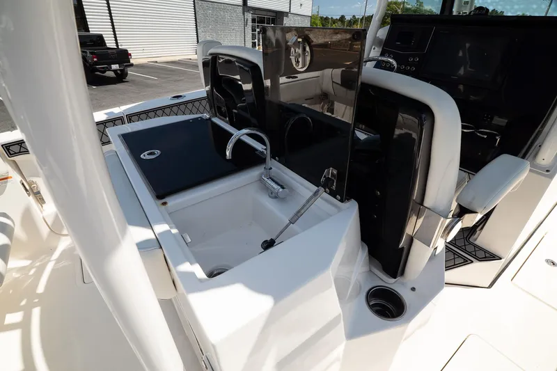 Slide: The Image of 2018 Wellcraft 302 Fisherman boat interior with sink and control panel. - 17