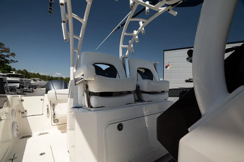 Slide: The Image of 2018 Wellcraft 302 Fisherman boat interior with white seating and modern design. - 19