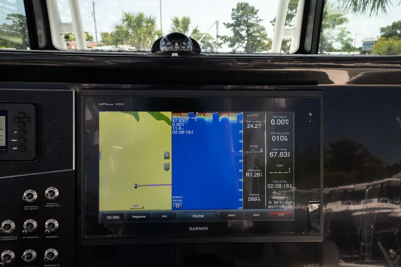 Slide: The Image of Garmin navigation display on 2018 Wellcraft 302 Fisherman boat dashboard. - 24