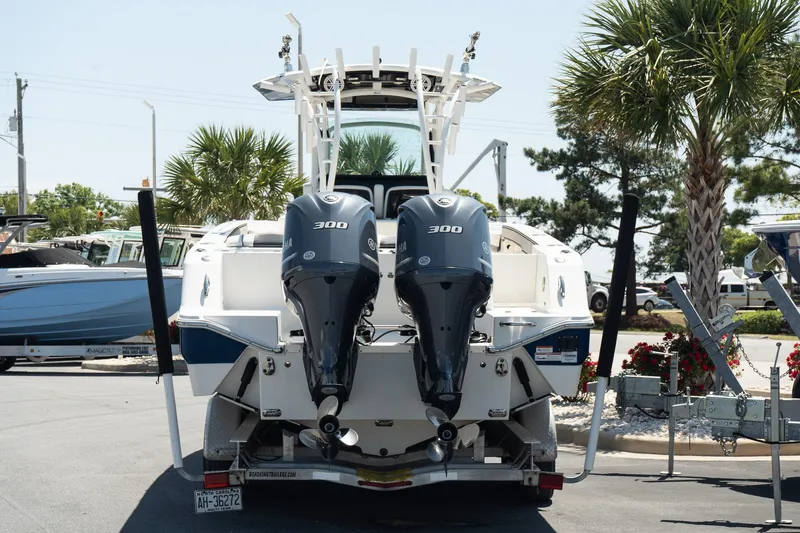 Slide: The Image of 2018 Wellcraft 302 Fisherman boat with dual 300 horsepower engines, parked outdoors. - 5