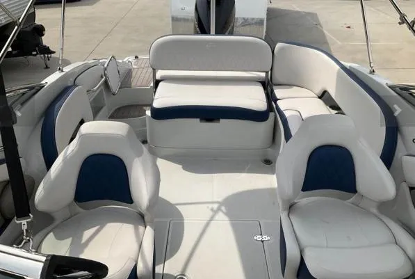 Slide: The Image of 2023 Crownline 260 XSS boat interior with white and blue seating arrangement. - 3