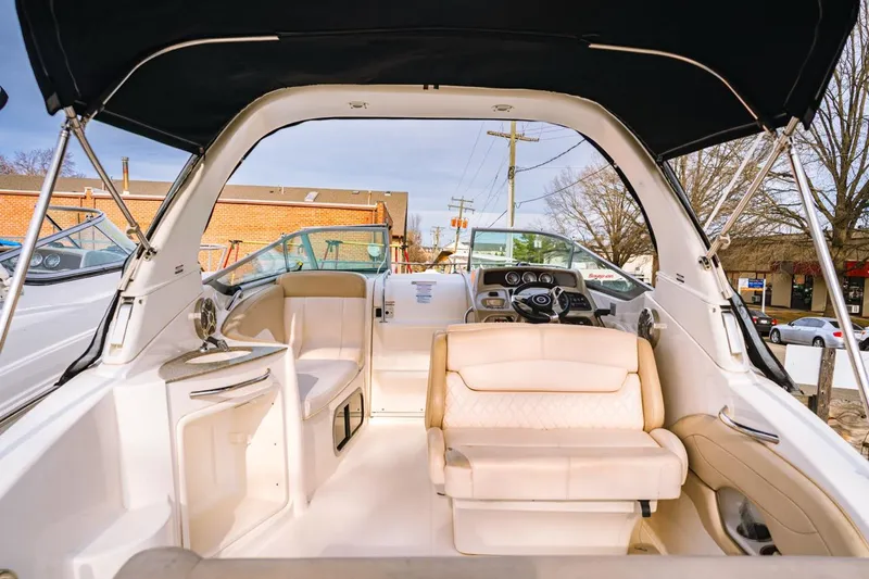 Slide: The Image of 2018 Chaparral 270 Signature boat interior with seating and helm, showcasing luxury design. - 4
