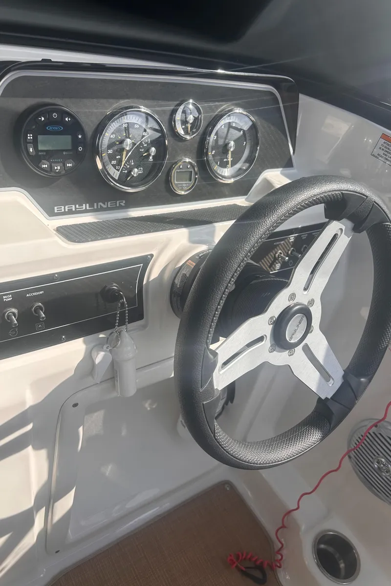 Slide: The Image of 2022 Bayliner DX2000 dashboard with steering wheel and instrument panel. - 6