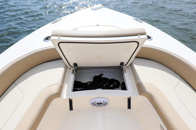 Slide: The Image of 2023 Scout 231 XSB boat with open storage compartment on deck. - 18