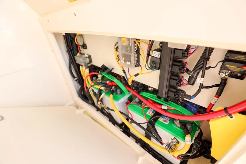 Slide: The Image of Electrical wiring and components inside a 2023 Scout 231 XSB boat. - 26