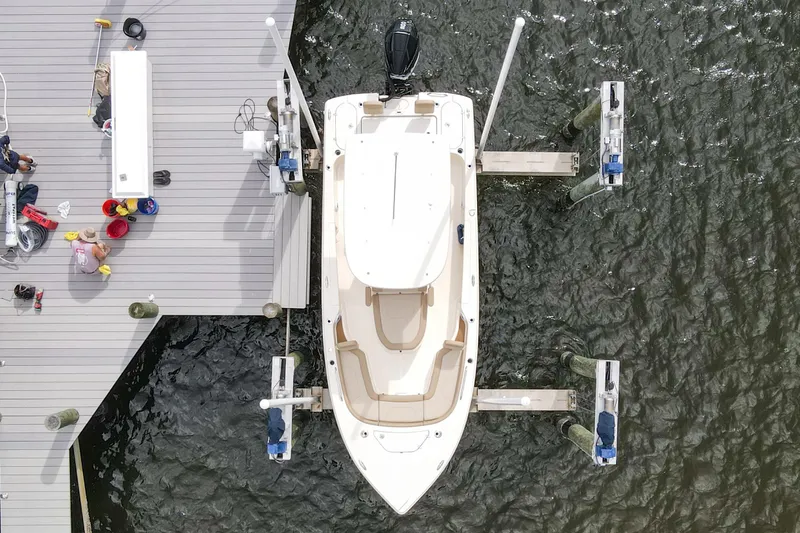 Slide: The Image of 2023 Scout 231 XSB boat docked at a marina, aerial view. - 28