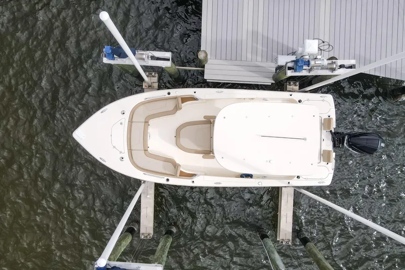 Slide: The Image of 2023 Scout 231 XSB boat docked, aerial view showcasing sleek design and spacious layout. - 30