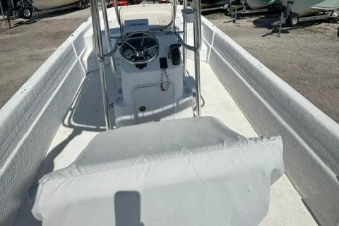 Slide: The Image of 2011 Carolina Skiff 198 DLV boat interior with steering console and seating. - 10