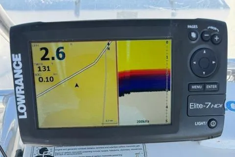 Slide: The Image of Lowrance Elite-7 HDI fishfinder on 2011 Carolina Skiff 198 DLV, displaying navigation and sonar data. - 13
