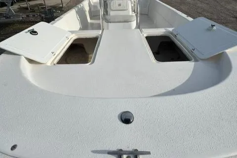 Slide: The Image of 2011 Carolina Skiff 198 DLV boat deck with open storage compartments. - 14