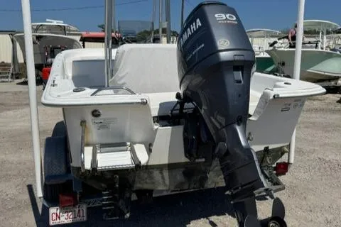 Slide: The Image of 2011 Carolina Skiff 198 DLV boat with Yamaha 90 outboard motor, parked on a trailer. - 7