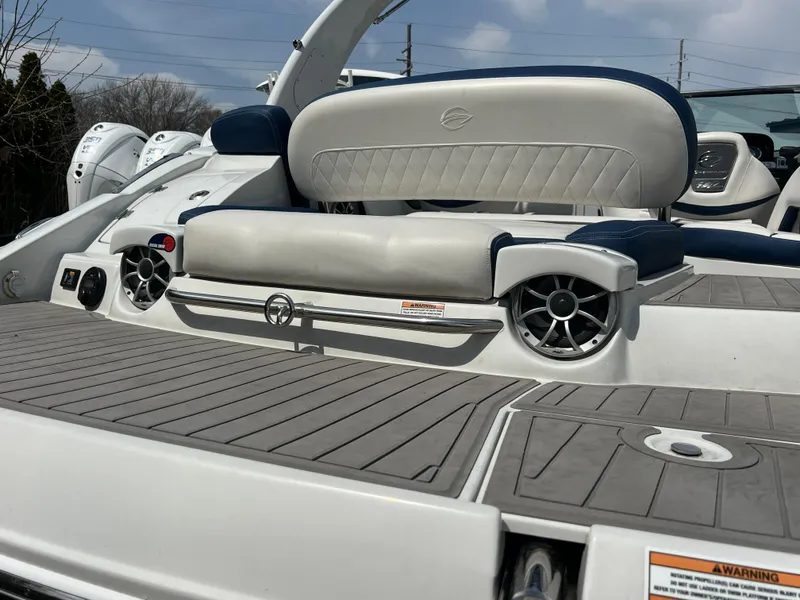 Slide: The Image of 2021 Crownline 255 SS boat with sleek seating and modern audio system. - 13
