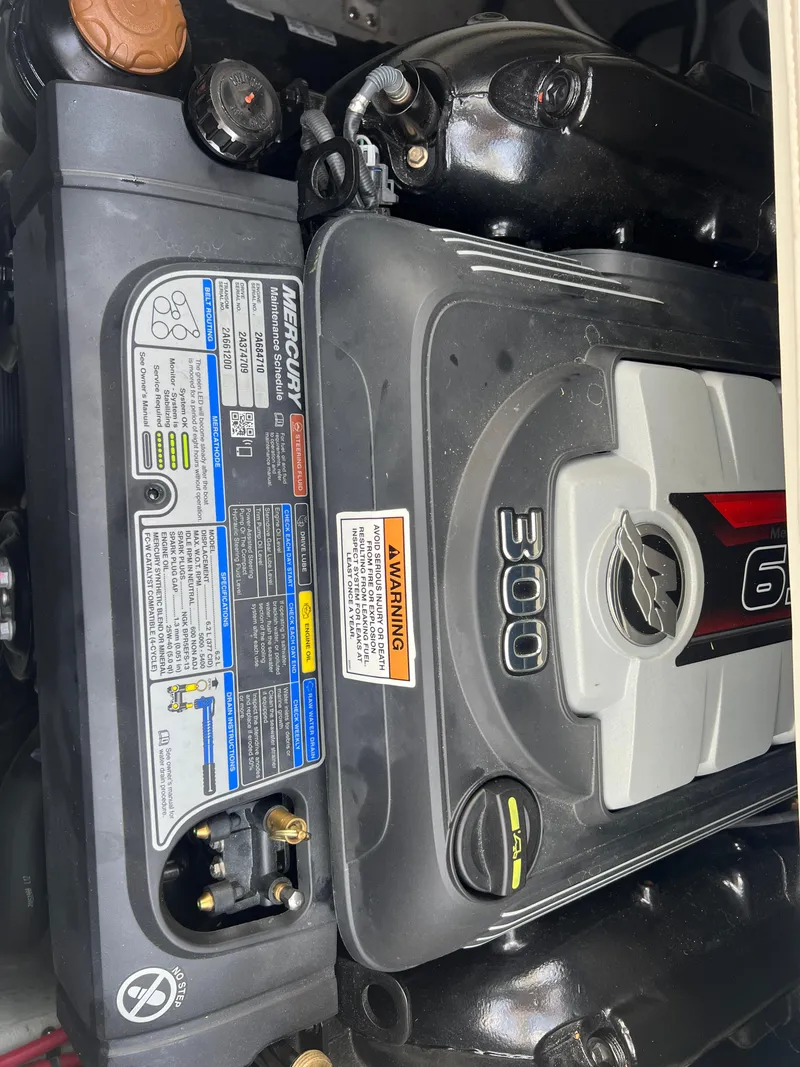 Slide: The Image of 2021 Crownline 255 SS engine, featuring a Mercury 300 horsepower motor. - 14