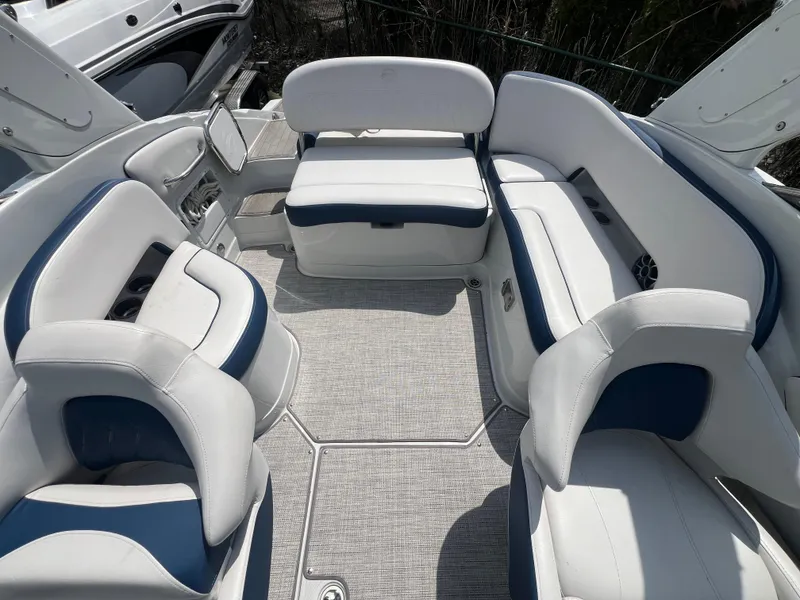 Slide: The Image of 2021 Crownline 255 SS boat interior with white and blue seating arrangement. - 4
