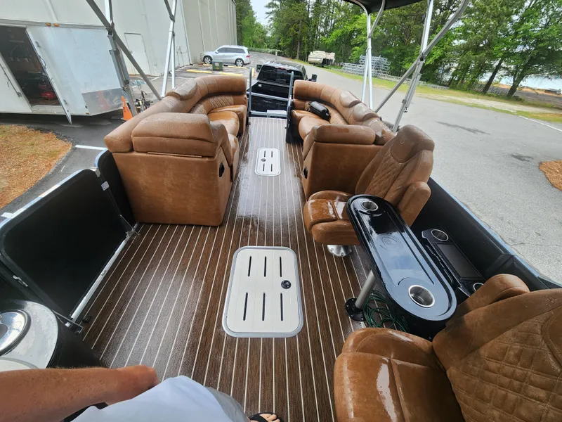 Slide: The Image of 2021 Premier 290 Grand View pontoon boat with luxurious seating and sleek design. - 13