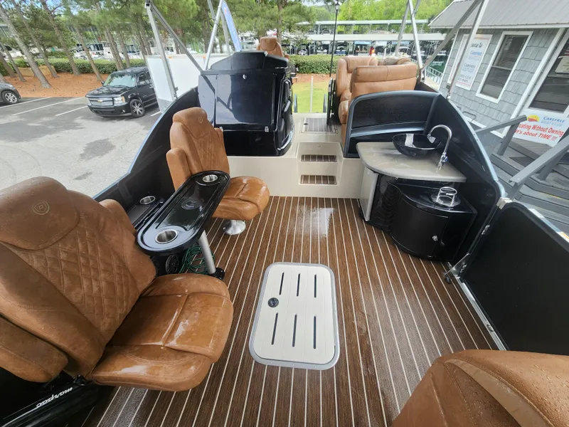 Slide: The Image of Luxurious interior of 2021 Premier 290 Grand View pontoon boat with plush seating and sleek design. - 15